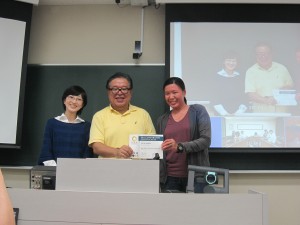 Representative Student for Sanriku Fieldwork 2014 receiving Completion Certificate from Professor Jun Murai and Professor Satoko Oki